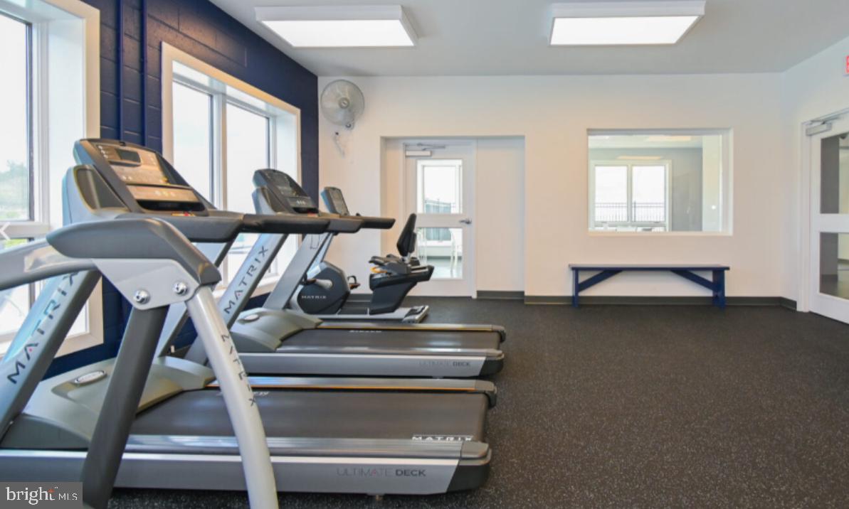 34 Queen Anne Way Chester, MD 21619 - Photo 45 of 52 a living room with a couch and a table