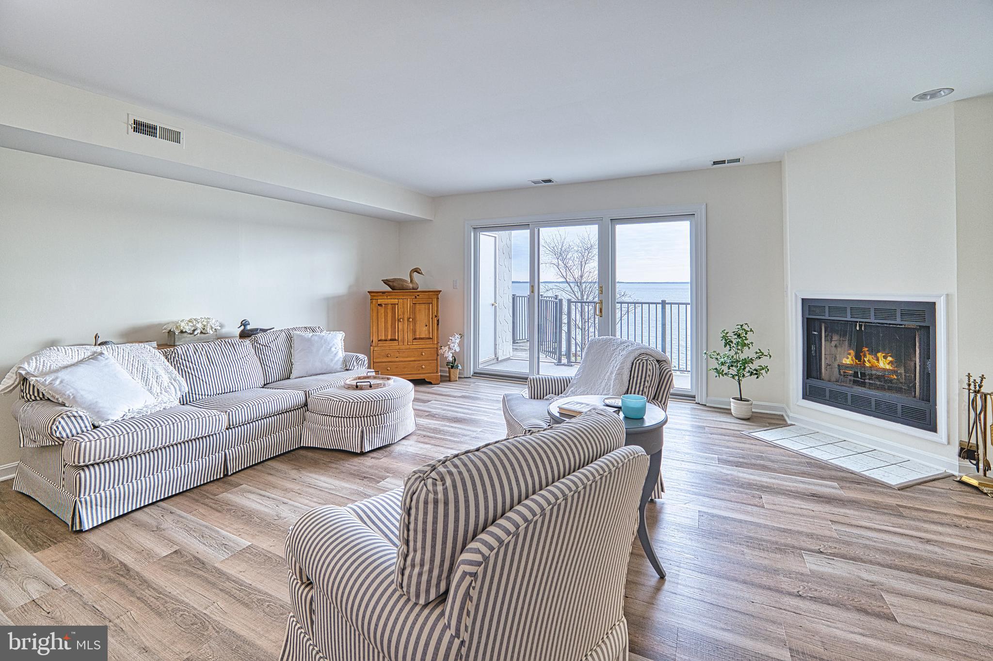 34 Queen Anne Way Chester, MD 21619 - Photo 7 of 52 a living room with furniture and a fireplace