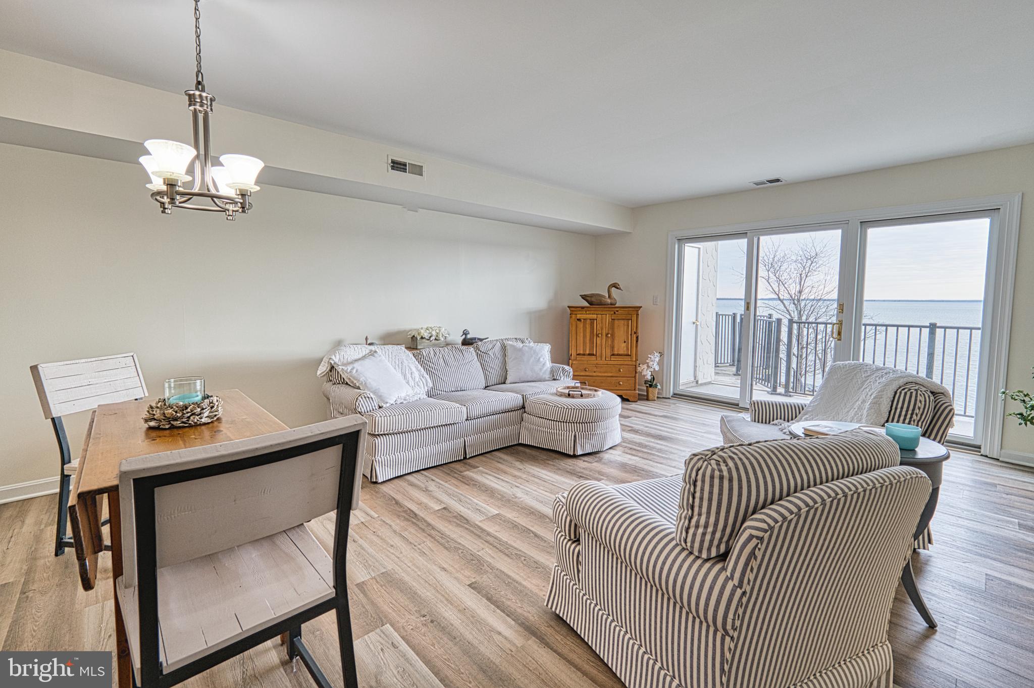 34 Queen Anne Way Chester, MD 21619 - Photo 9 of 52 a living room with furniture or outdoor view and a window