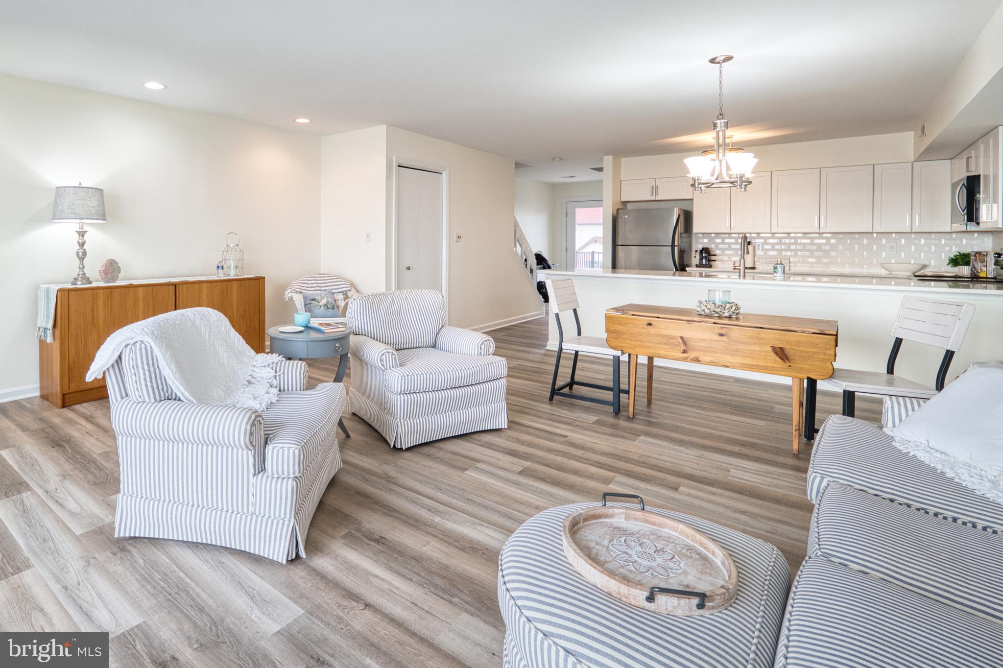 34 Queen Anne Way Chester, MD 21619 - Photo 10 of 52 a living room with furniture and a wooden floor