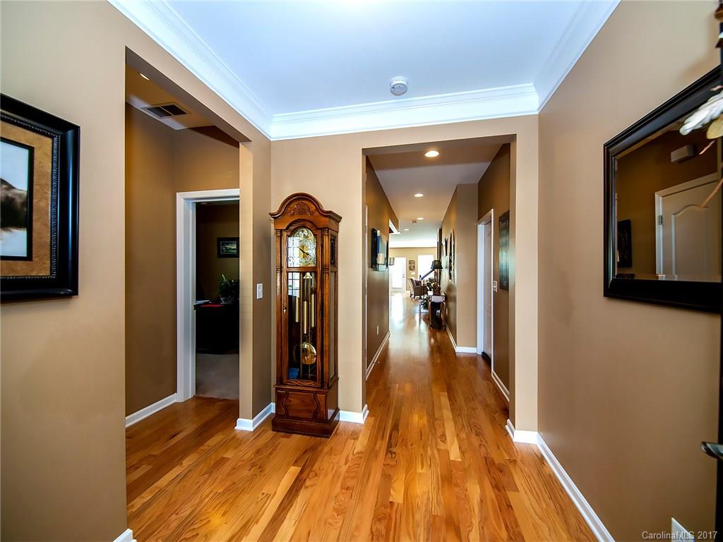 4242 Perth Road Indian Land, SC 29707 - Photo 2 of 24 a view of a hallway with wooden floor and staircase