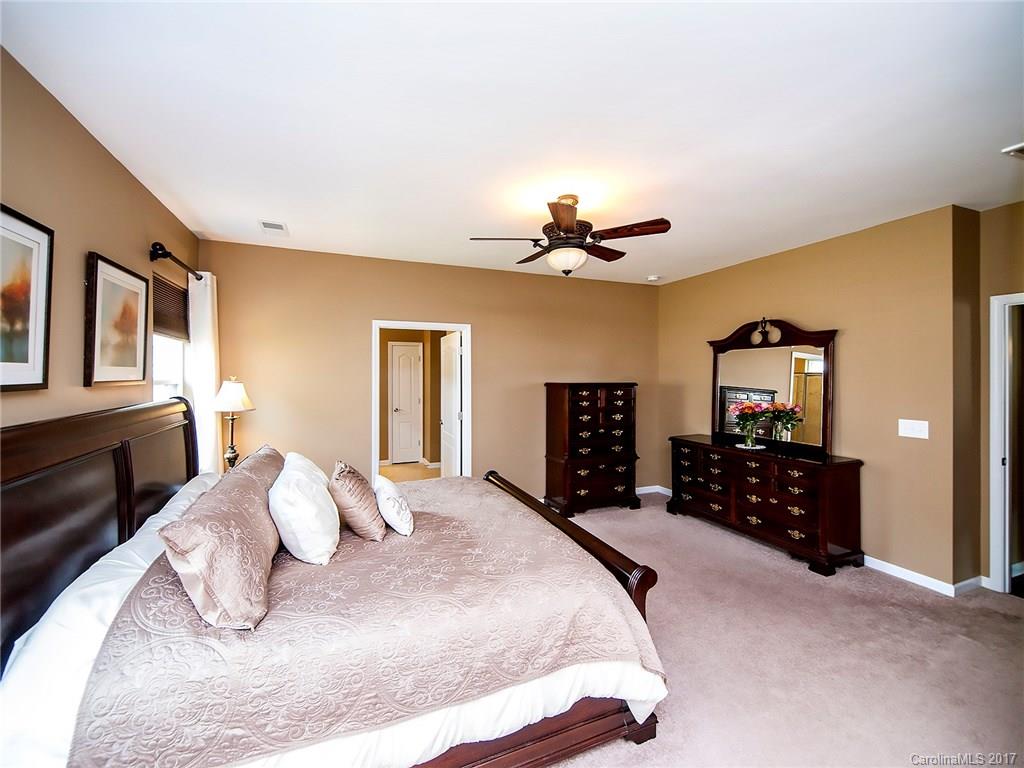 4242 Perth Road Indian Land, SC 29707 - Photo 14 of 24 a bedroom with a bed and cabinets