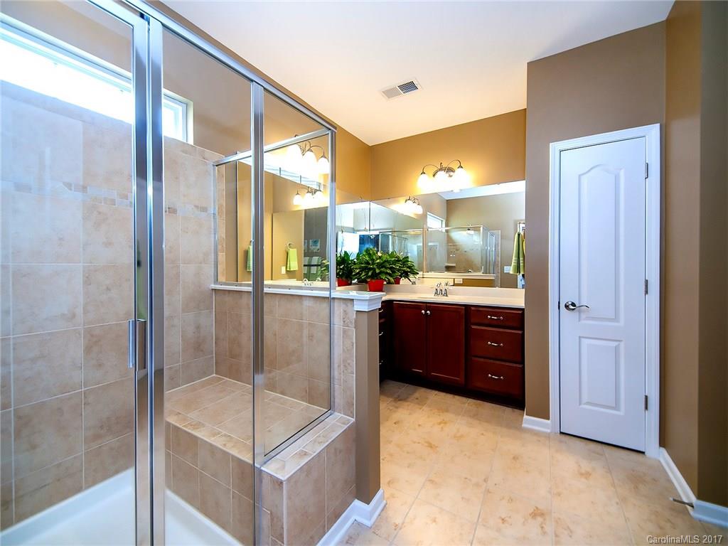 4242 Perth Road Indian Land, SC 29707 - Photo 15 of 24 a bathroom with a tub a sink and mirror