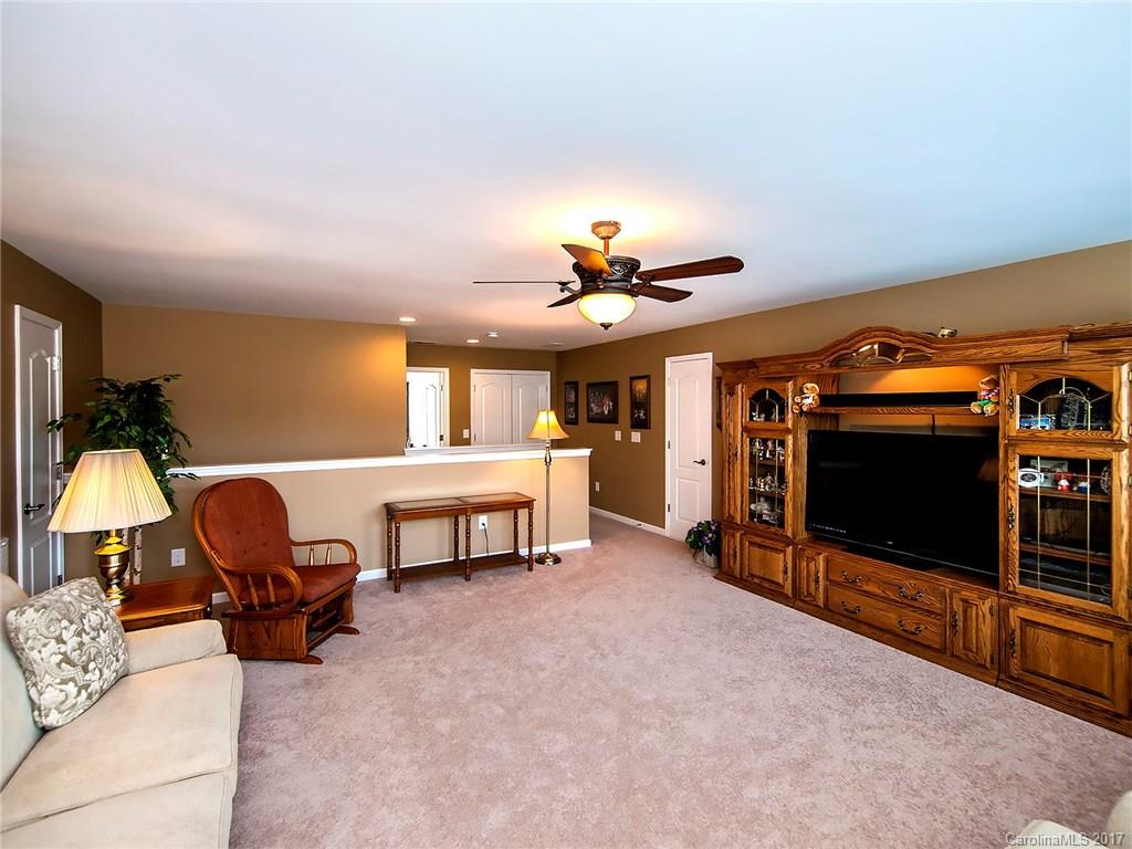 4242 Perth Road Indian Land, SC 29707 - Photo 18 of 24 a living room with furniture and a flat screen tv