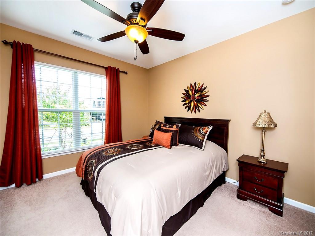 4242 Perth Road Indian Land, SC 29707 - Photo 3 of 24 a bed sitting in a bedroom next to a window