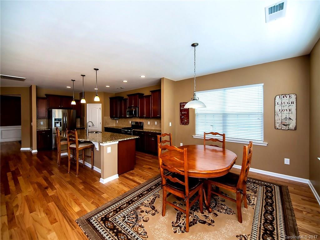 4242 Perth Road Indian Land, SC 29707 - Photo 10 of 24 a living room with dining room and kitchen view