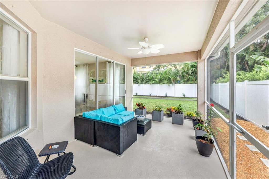 8260 Laurel Lakes Boulevard Naples, FL 34119 - Photo 29 of 41 a room with furniture and a large window