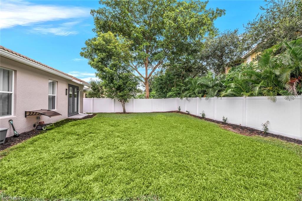 8260 Laurel Lakes Boulevard Naples, FL 34119 - Photo 33 of 41 a view of yard with green space