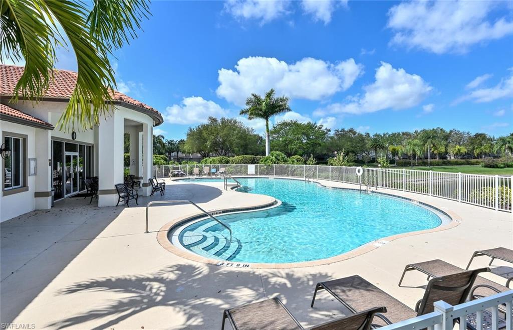 8260 Laurel Lakes Boulevard Naples, FL 34119 - Photo 36 of 41 a view of a swimming pool with a patio