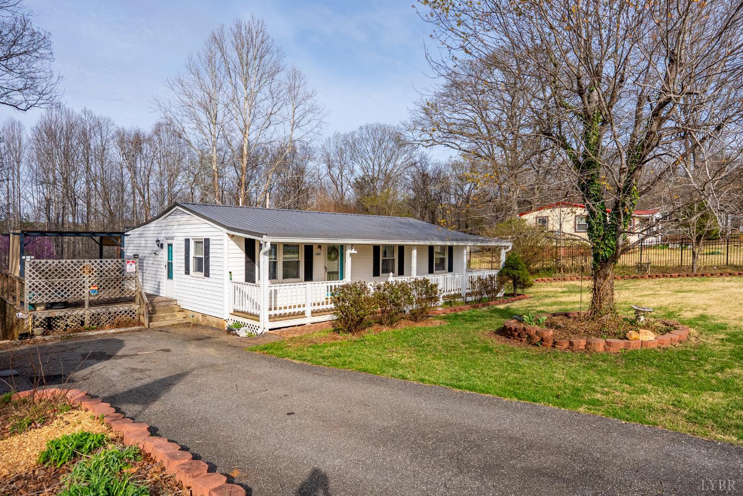 997 Toytown Road Amherst, VA 24521 - Photo 24 of 50 a house with trees in the background