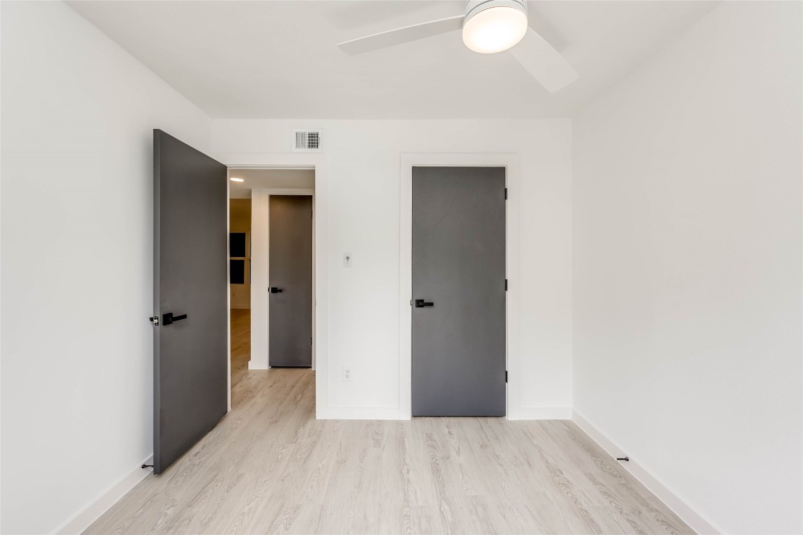513 Pecan Grove Road, Unit 102 Austin, TX 78704 - Photo 10 of 15 a view of hallway with wooden floor