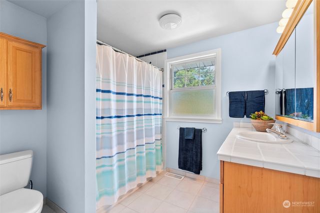 a bedroom with a bed and a lamp