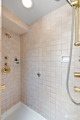 a living room with hard wood flooring and a table