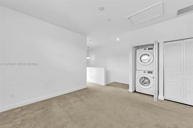 a view of a hallway to closet