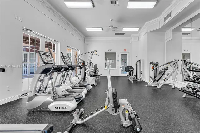 a front view of a house with a garden and plants