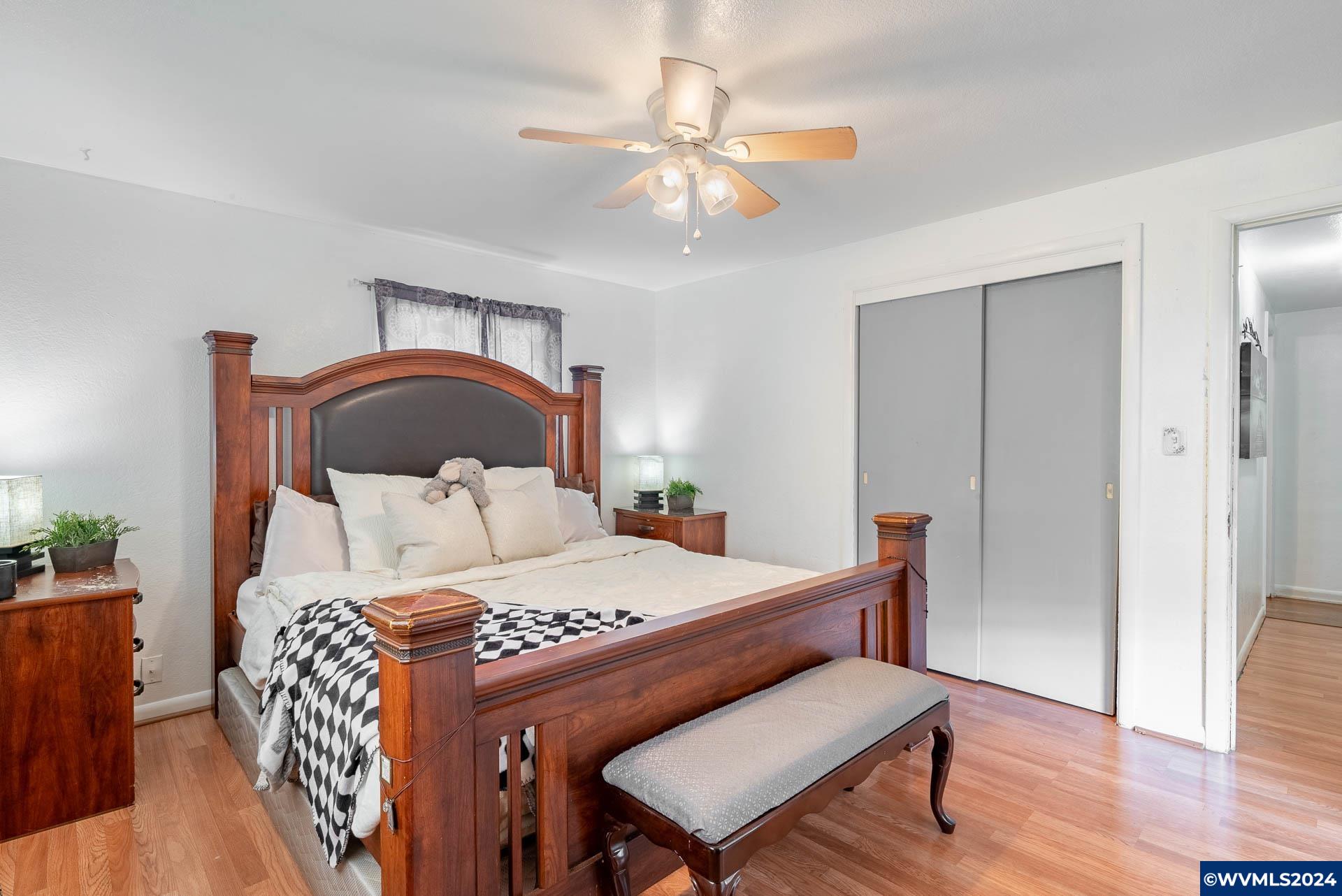 1530 2nd Avenue Albany, OR 97321 - Photo 23 of 35 a bedroom with a bed and a chandelier
