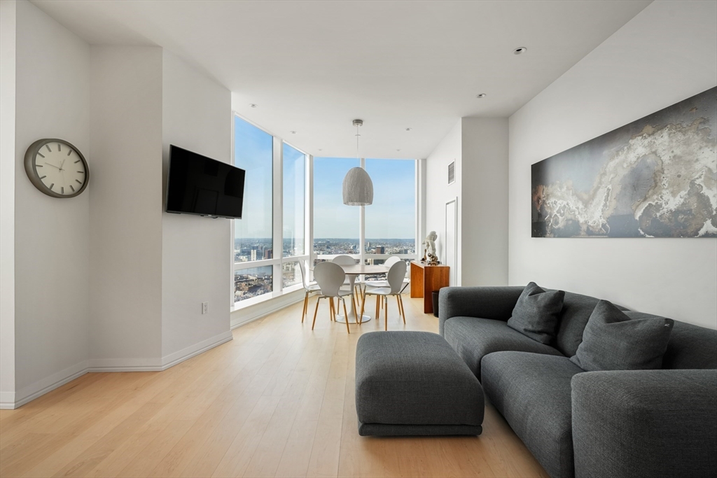 1 Franklin Street, Unit 4802 Boston, MA 02110 - Photo 11 of 42 a living room with furniture and a flat screen tv