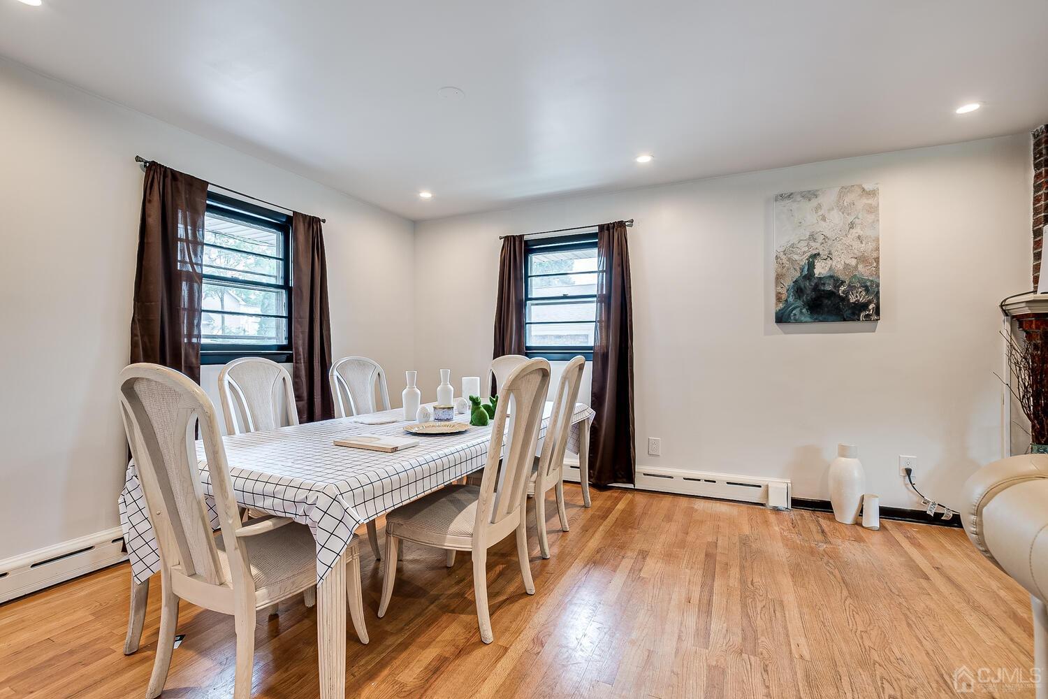 319 Chain O' Hills Road Colonia, NJ 07067 - Photo 13 of 37 a view of a dining room with furniture window and wooden floor
