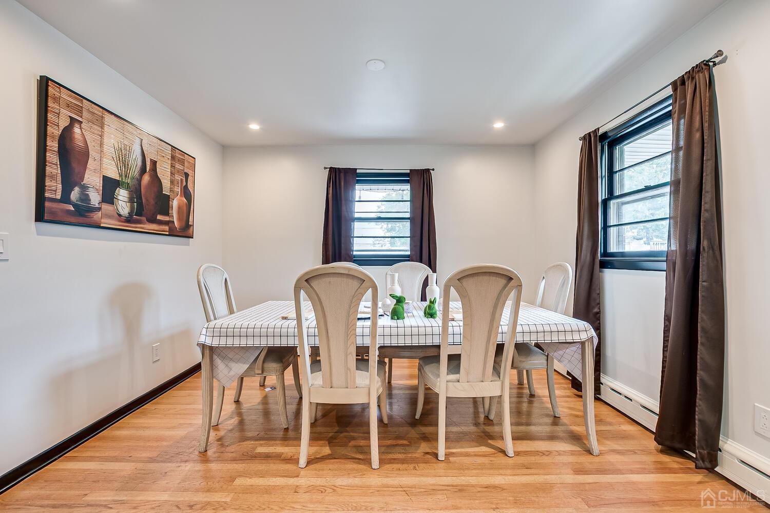 319 Chain O' Hills Road Colonia, NJ 07067 - Photo 15 of 37 a view of a dining room with furniture window and wooden floor