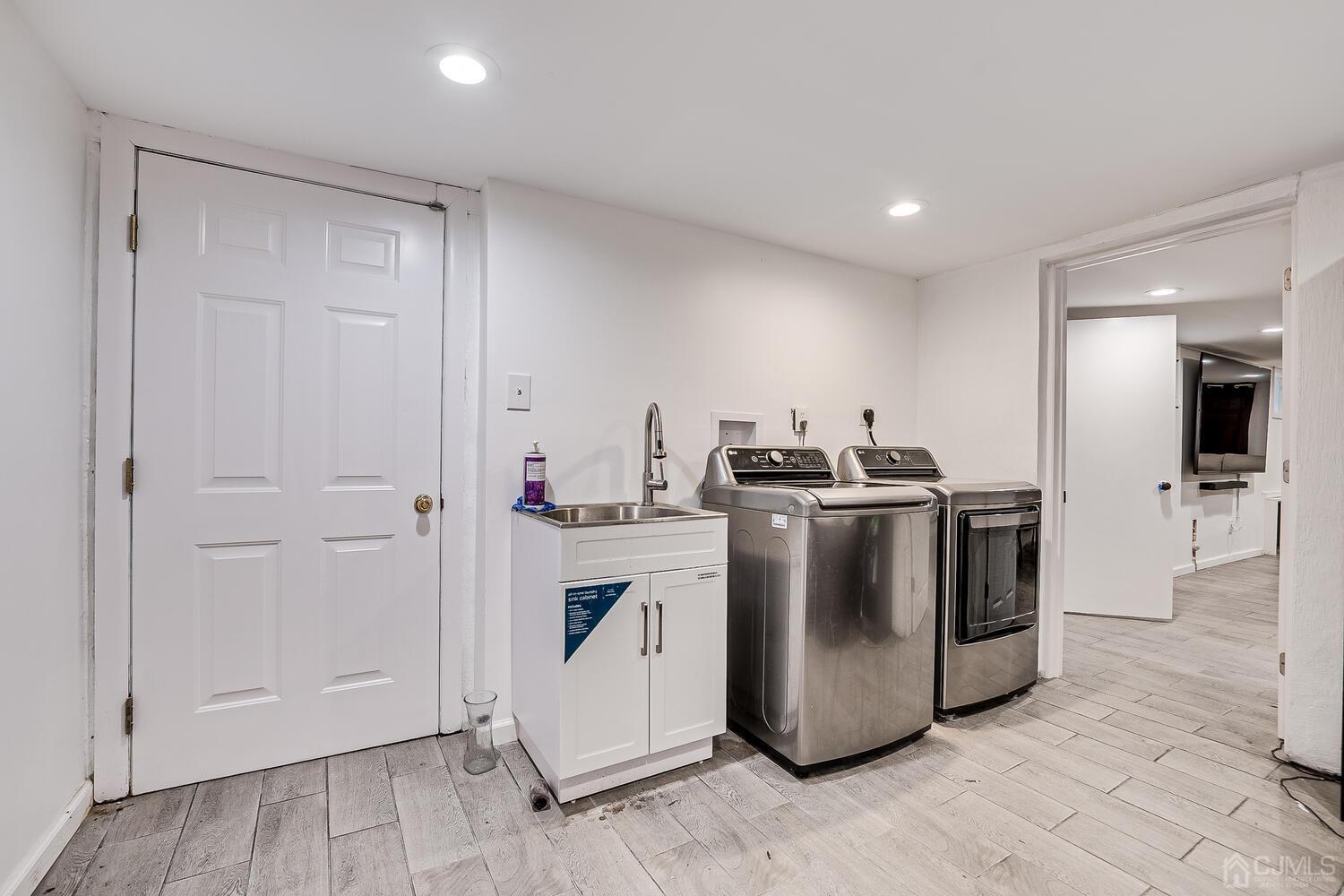319 Chain O' Hills Road Colonia, NJ 07067 - Photo 29 of 37 a utility room with washer and dryer