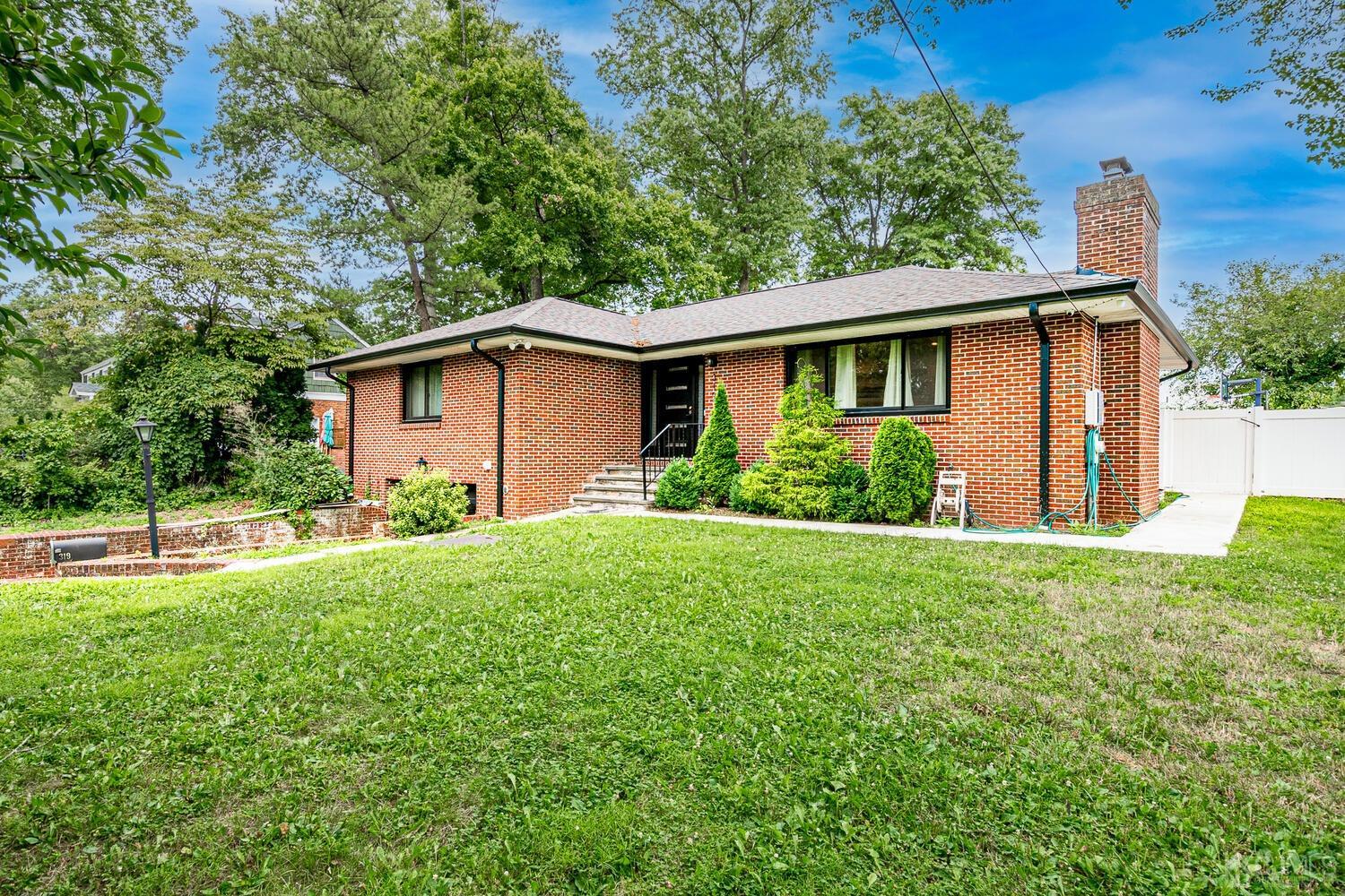 319 Chain O' Hills Road Colonia, NJ 07067 - Photo 3 of 37 a house view with a garden space