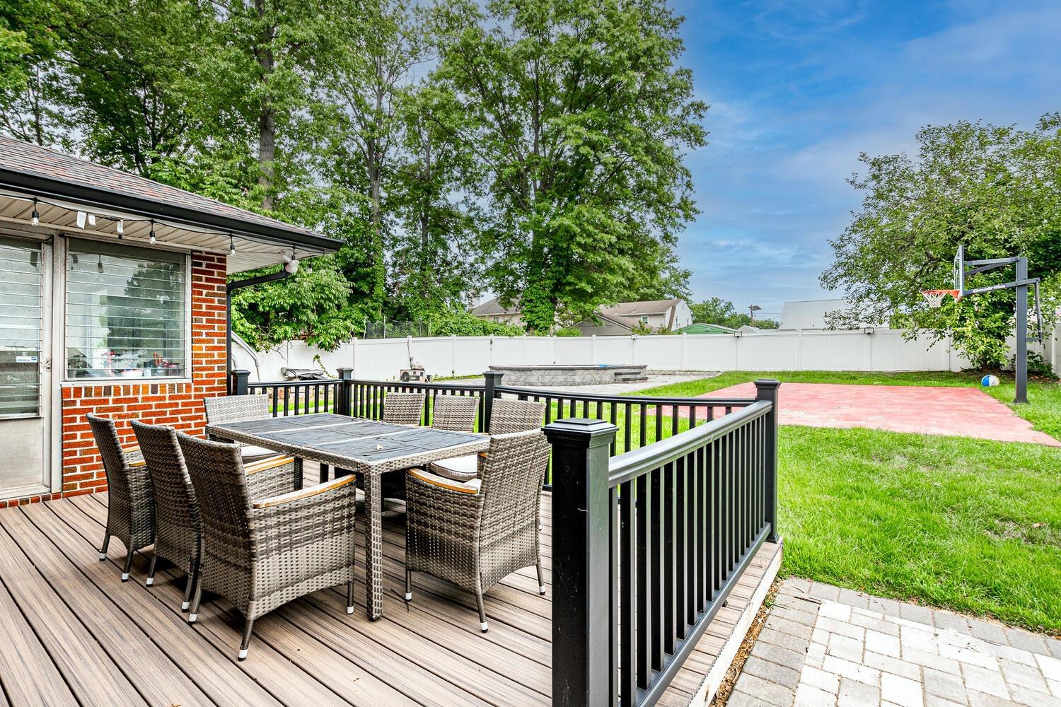 319 Chain O' Hills Road Colonia, NJ 07067 - Photo 33 of 37 a view of a roof deck with wooden floor and fence