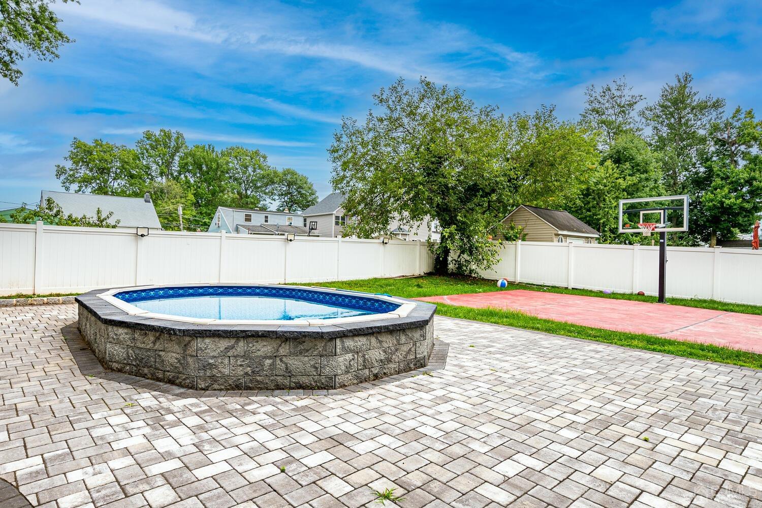 319 Chain O' Hills Road Colonia, NJ 07067 - Photo 35 of 37 a view of a backyard with plants and tree
