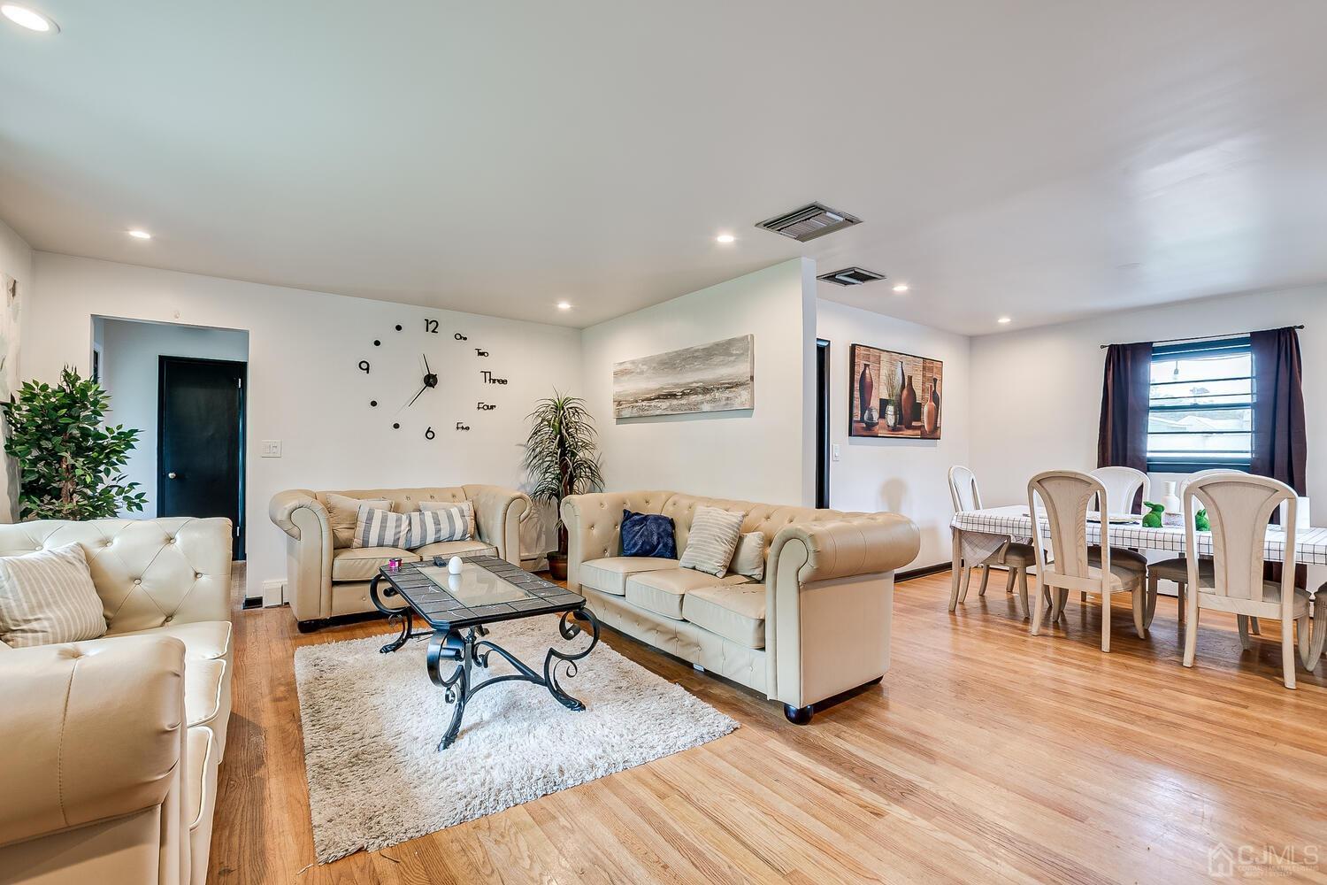 319 Chain O' Hills Road Colonia, NJ 07067 - Photo 5 of 37 a living room with furniture and wooden floor