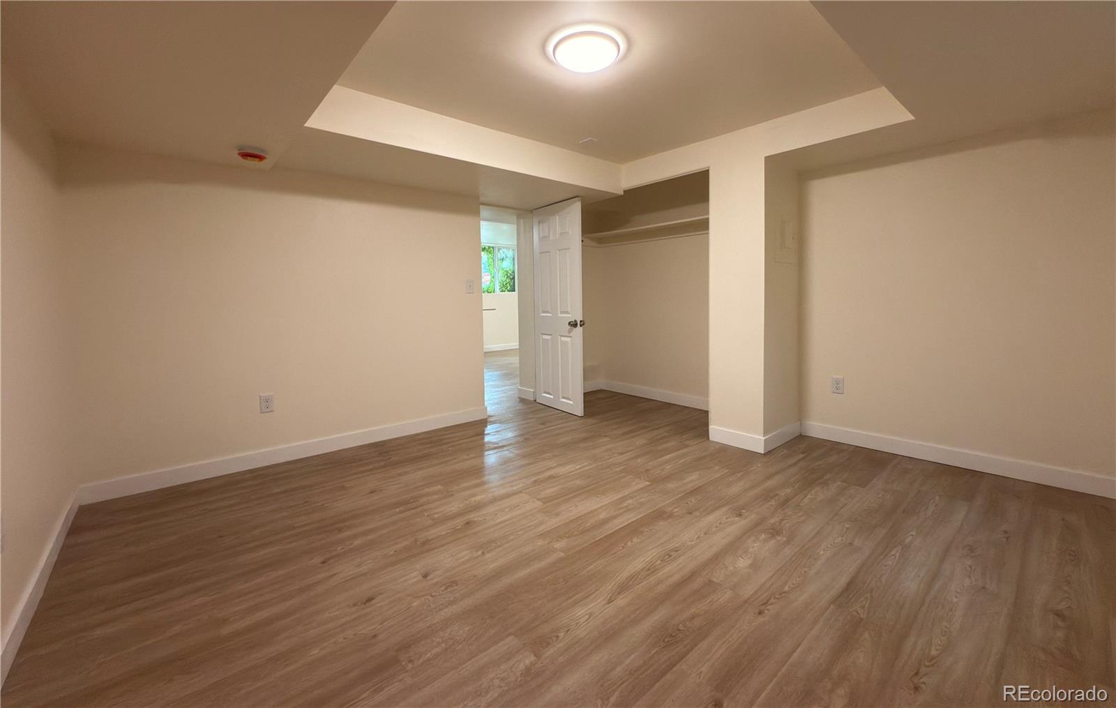 2201 South High Street, Unit 1832 Denver, CO 80210 - Photo 7 of 9 a view of an empty room with wooden floor