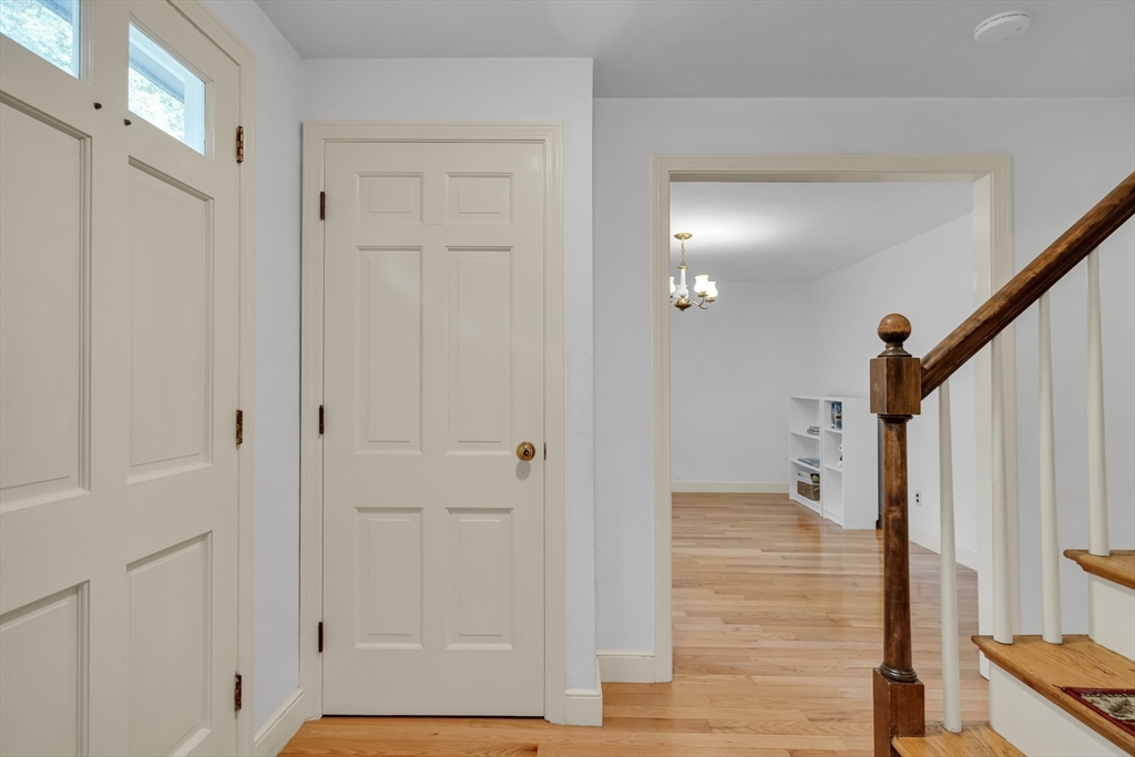 32 Dewey Road Lexington, MA 02420 - Photo 2 of 32 a view of a hallway with wooden floor and staircase