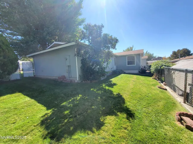 a view of a back yard of the house