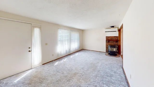 an empty room with a empty space and window