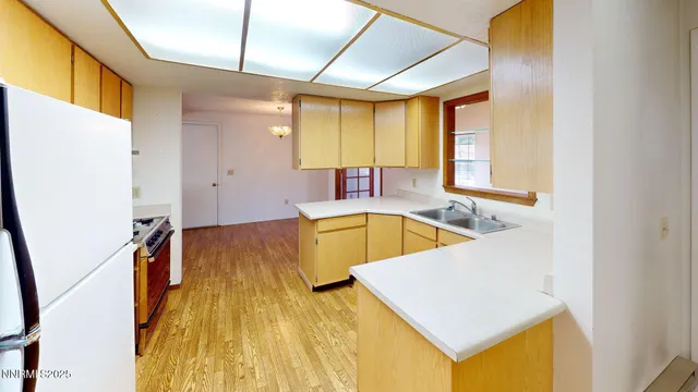 a view of a kitchen with a tub and windows