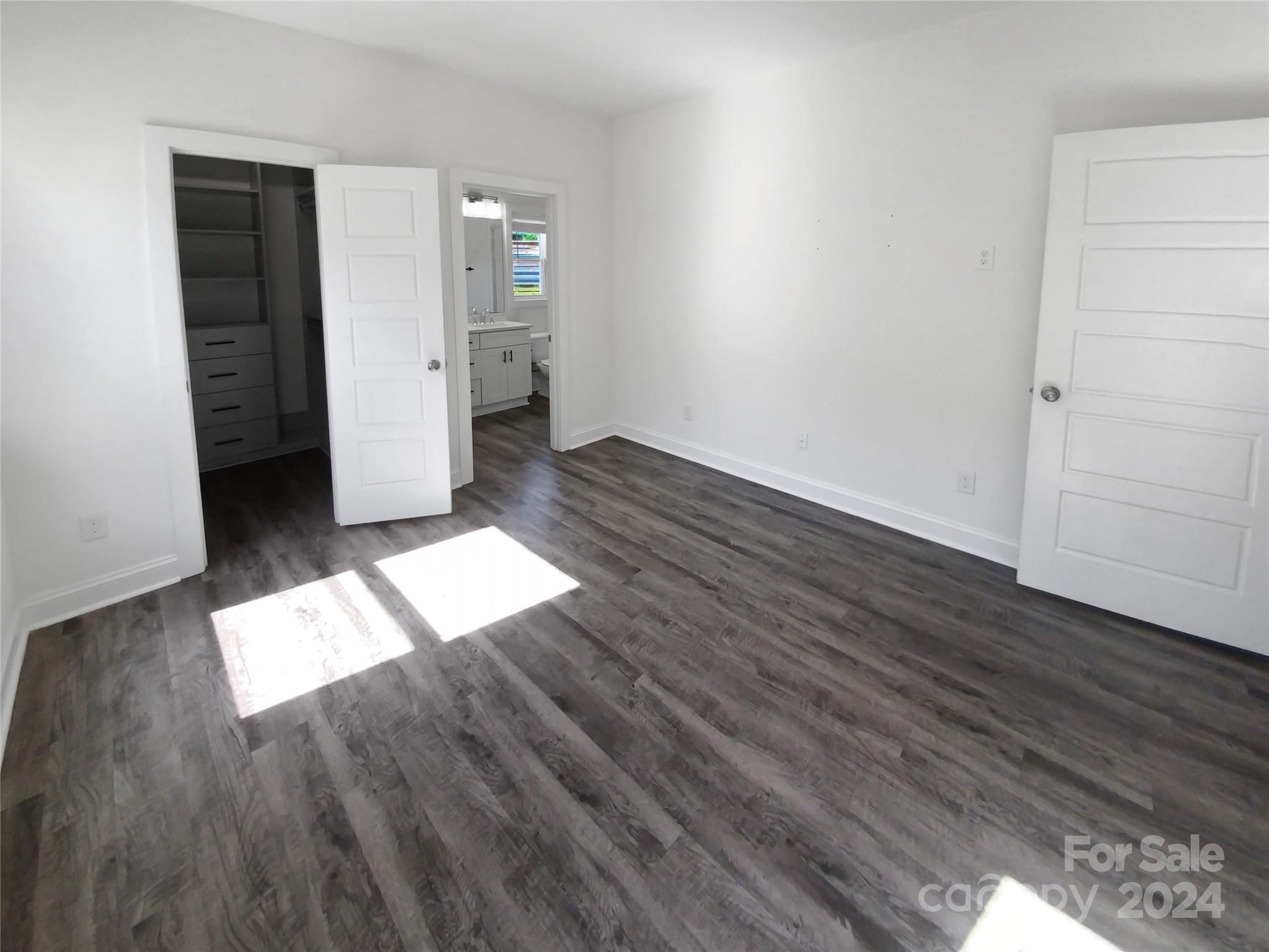 6110 Robinson Church Road Charlotte, NC 28215 - Photo 13 of 17 an empty room with wooden floor and closet
