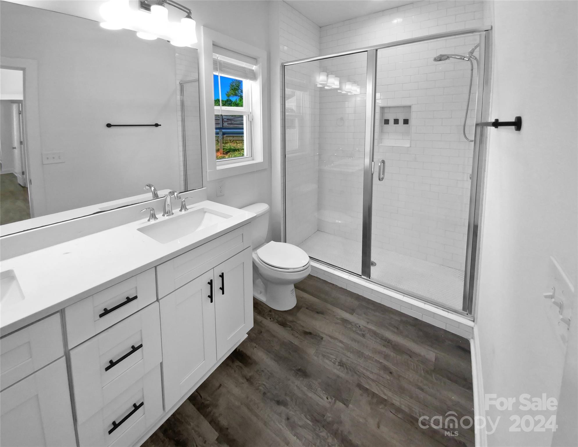 6110 Robinson Church Road Charlotte, NC 28215 - Photo 14 of 17 a bathroom with a double vanity sink toilet and shower