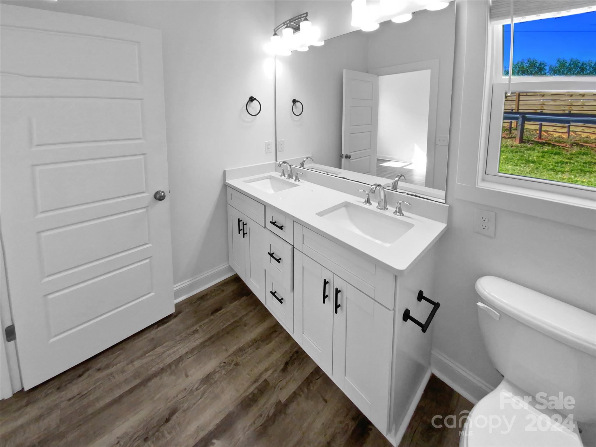 6110 Robinson Church Road Charlotte, NC 28215 - Photo 15 of 17 a bathroom with a sink and a mirror