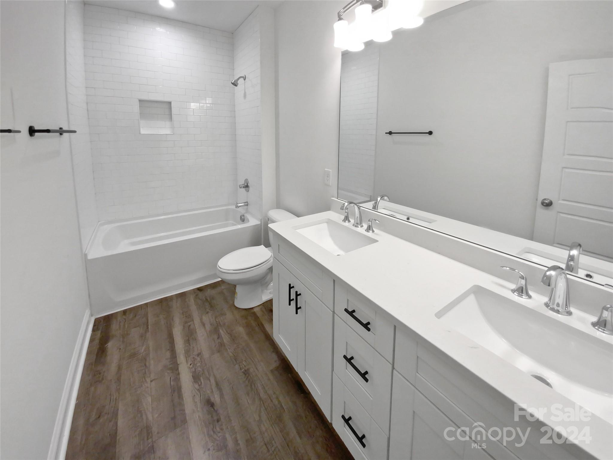 6110 Robinson Church Road Charlotte, NC 28215 - Photo 16 of 17 a bathroom with a double vanity sink and a mirror