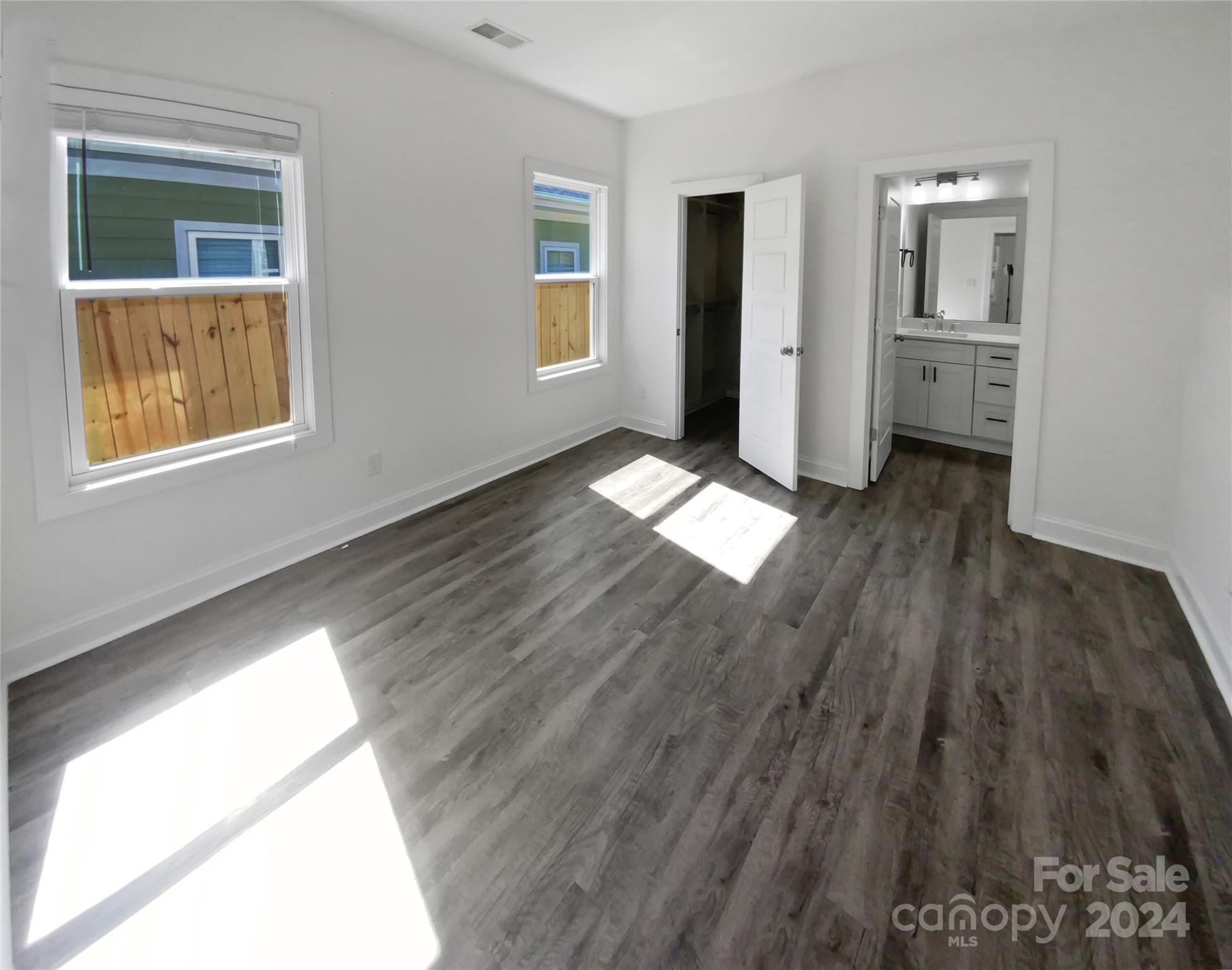 6110 Robinson Church Road Charlotte, NC 28215 - Photo 4 of 17 a view of empty room with wooden floor and window