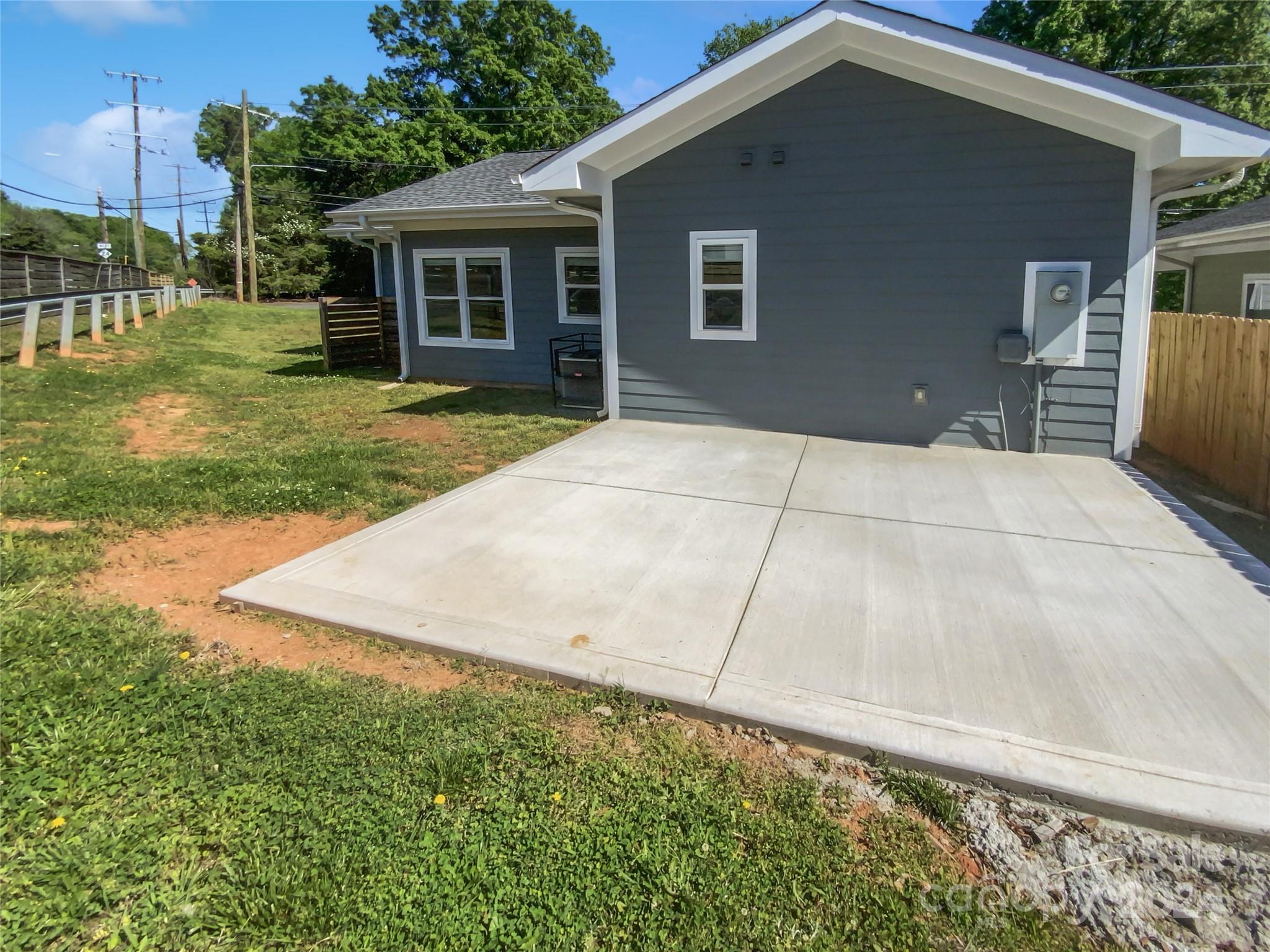 6110 Robinson Church Road Charlotte, NC 28215 - Photo 5 of 17 a backyard of a house with yard and outdoor seating