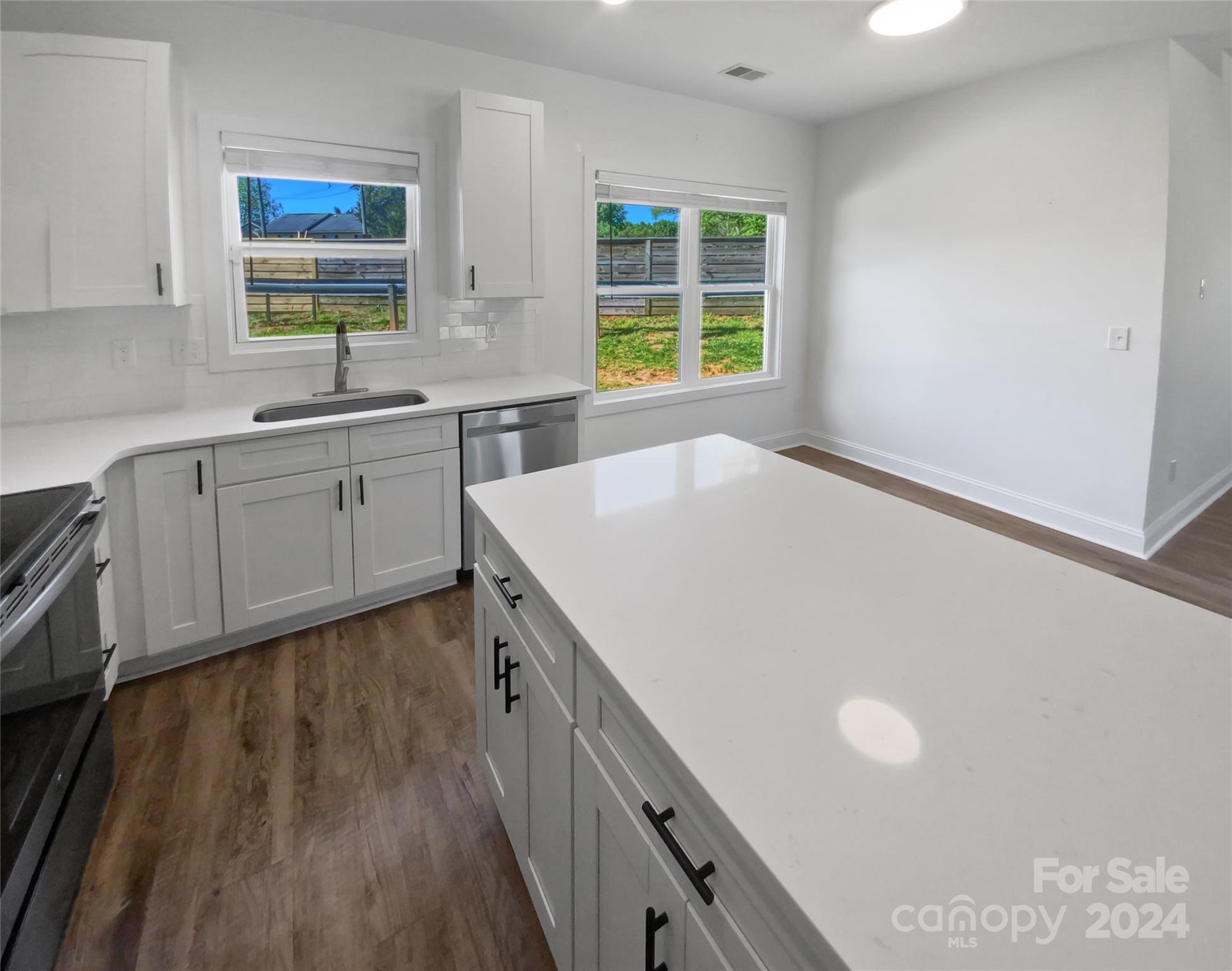 6110 Robinson Church Road Charlotte, NC 28215 - Photo 10 of 17 a kitchen with a sink a window and cabinets
