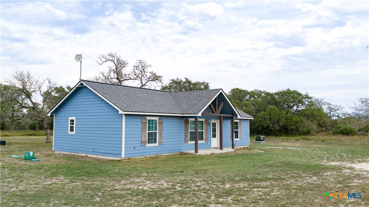 618 McGuill Road Goliad, TX 77963 - Photo 11 of 48 a view of a yard in front of a house with large trees