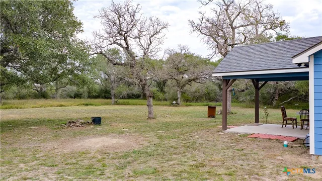 a view of backyard with green space