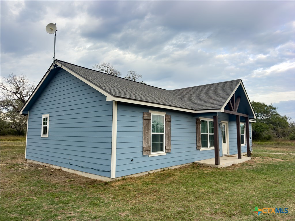 618 McGuill Road Goliad, TX 77963 - Photo 17 of 48 a front view of a house with a garden