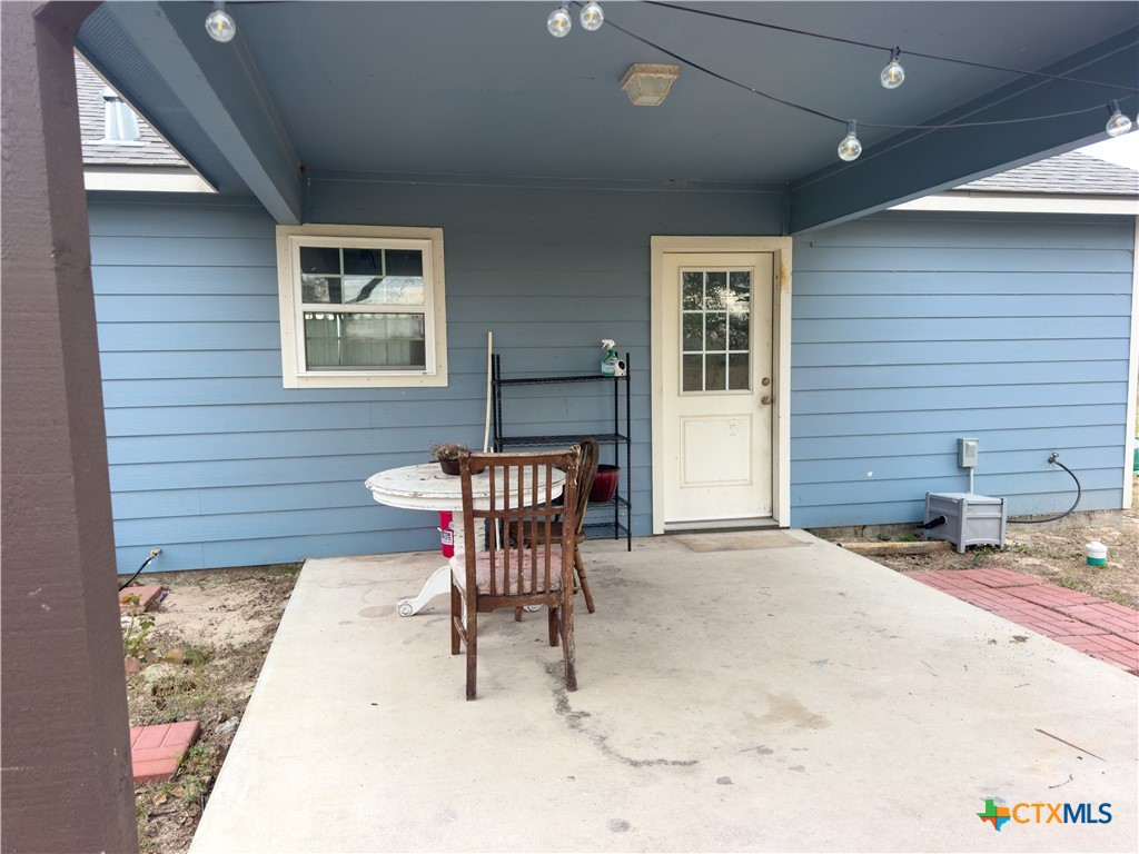 618 McGuill Road Goliad, TX 77963 - Photo 18 of 48 a patio with a table and chairs and potted plants