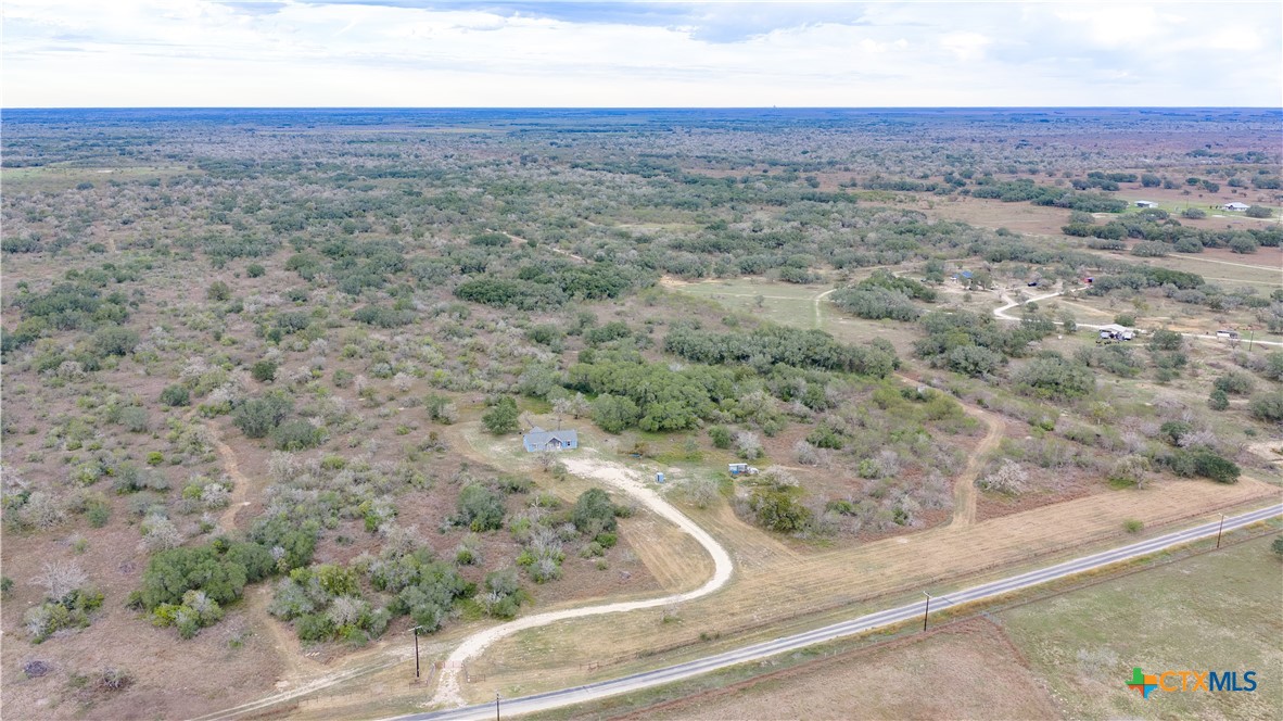 618 McGuill Road Goliad, TX 77963 - Photo 25 of 48 an aerial view of house with yard and mountain view in back