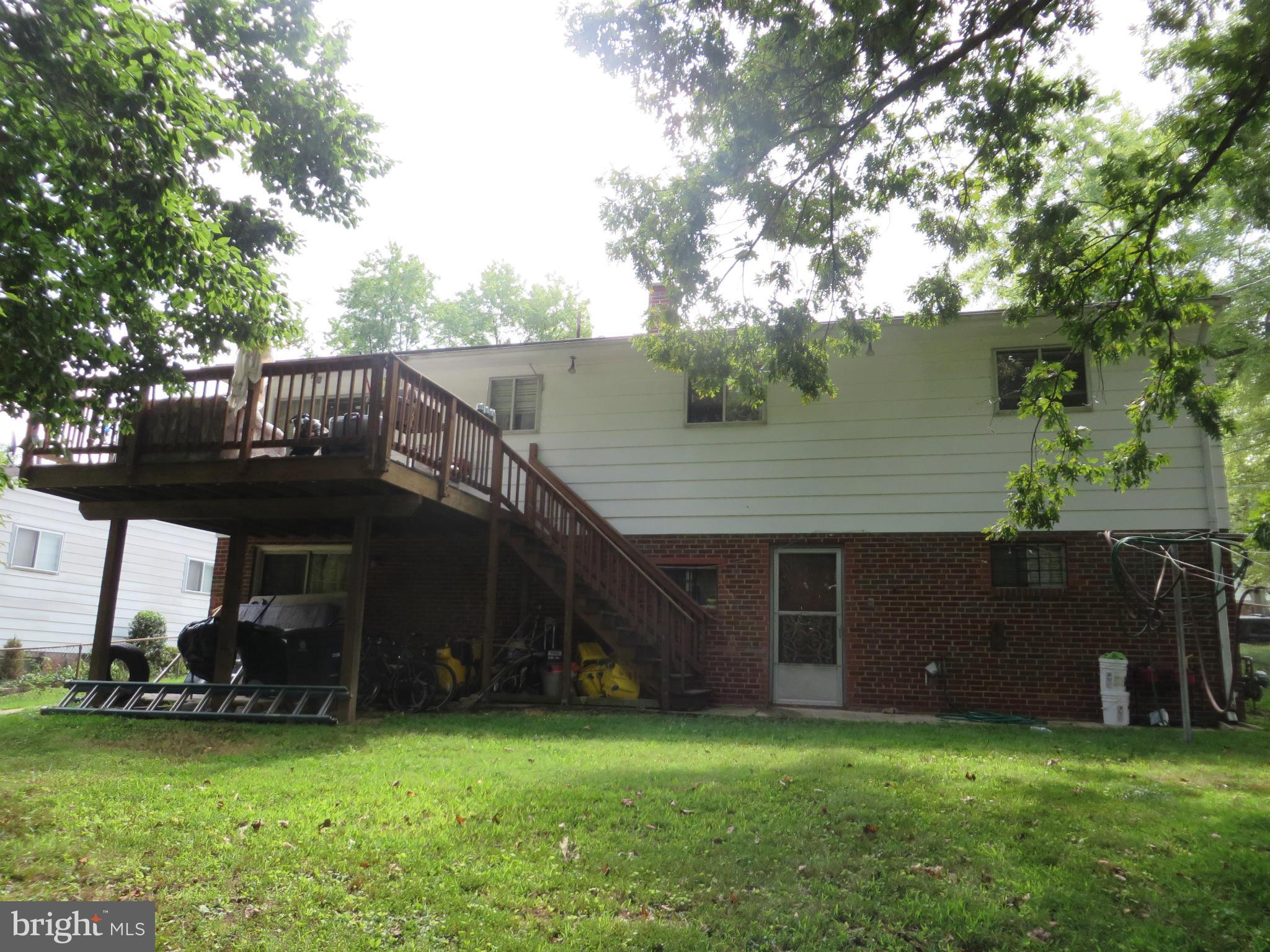 8902 Crandall Road Lanham, MD 20706 - Photo 2 of 2 a view of a house with a yard and a large tree