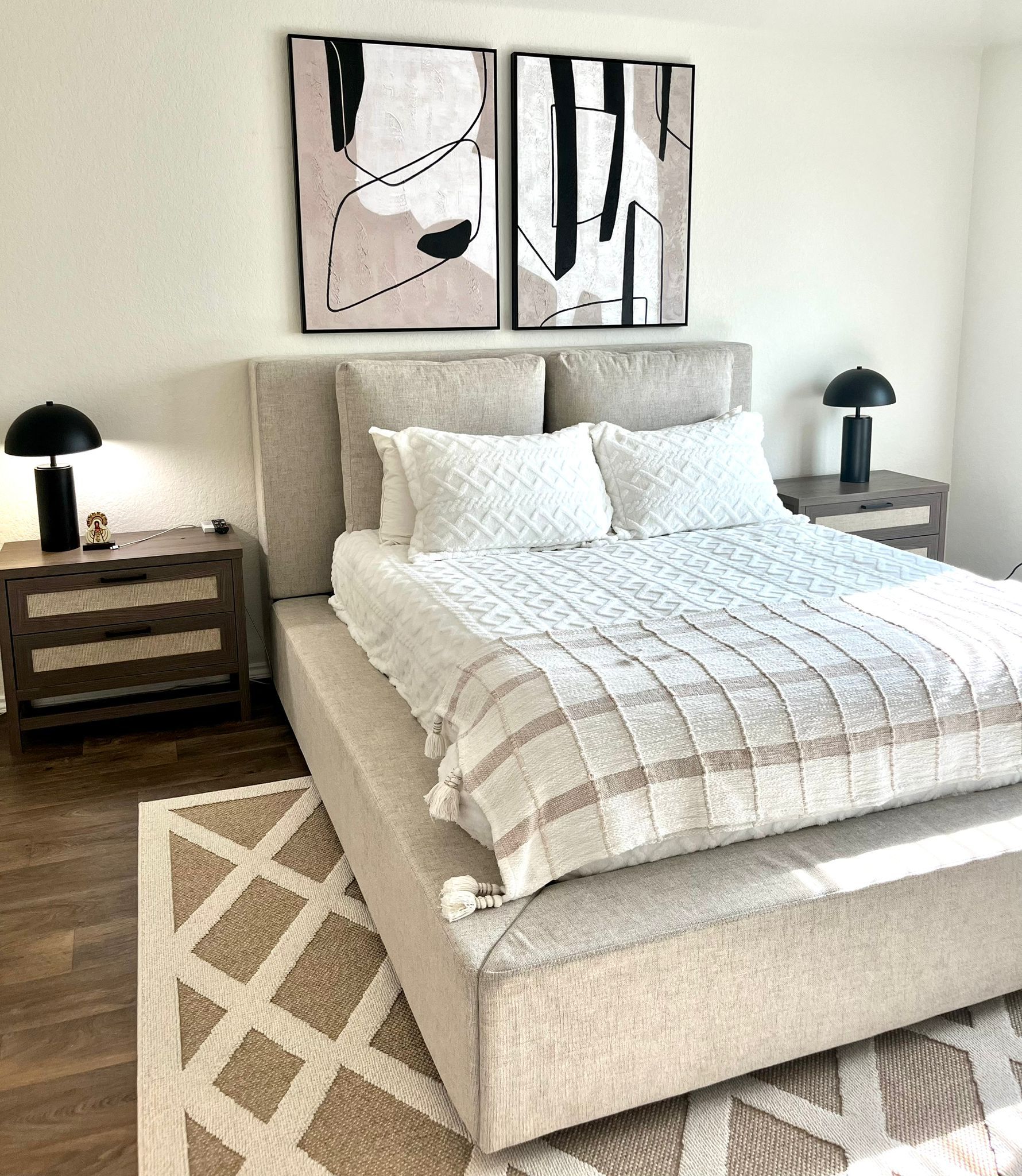 15006 Breccia Road Manor, TX 78653 - Photo 5 of 8 a bedroom with a bed and a night stand next to a window