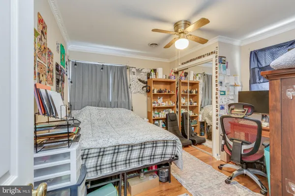 a bedroom with furniture and a chandelier