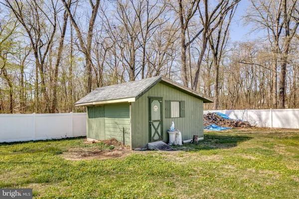 a backyard of a house with yard and garage