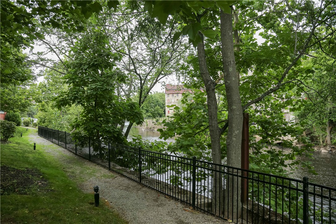 99 Allen Street, Unit 118 Woonsocket, RI 02895 - Photo 4 of 38 The Blackstone river from the walking path at the Lofts at Allen Street condominium complex.